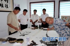 著名书画家石金库、刘长朋应邀到驻马店进行艺术交流