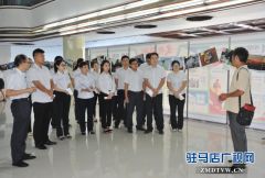 中原银行驻马店分行举办“幸福·中原人”摄影书画展受好评