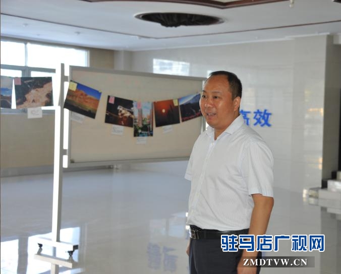 中原银行驻马店分行举办“幸福·中原人”摄影书画展受好评